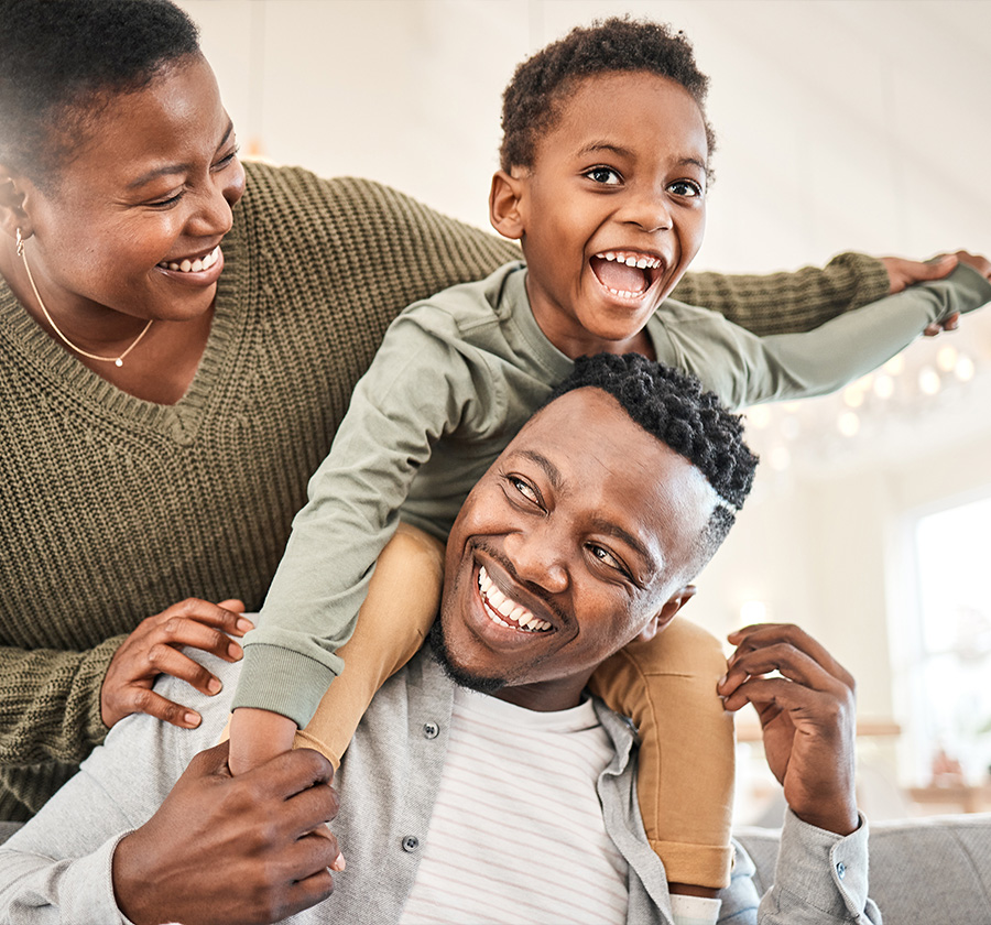 mom dad and son laughing